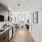 kitchen with stainless steel appliances with open concept to living room 