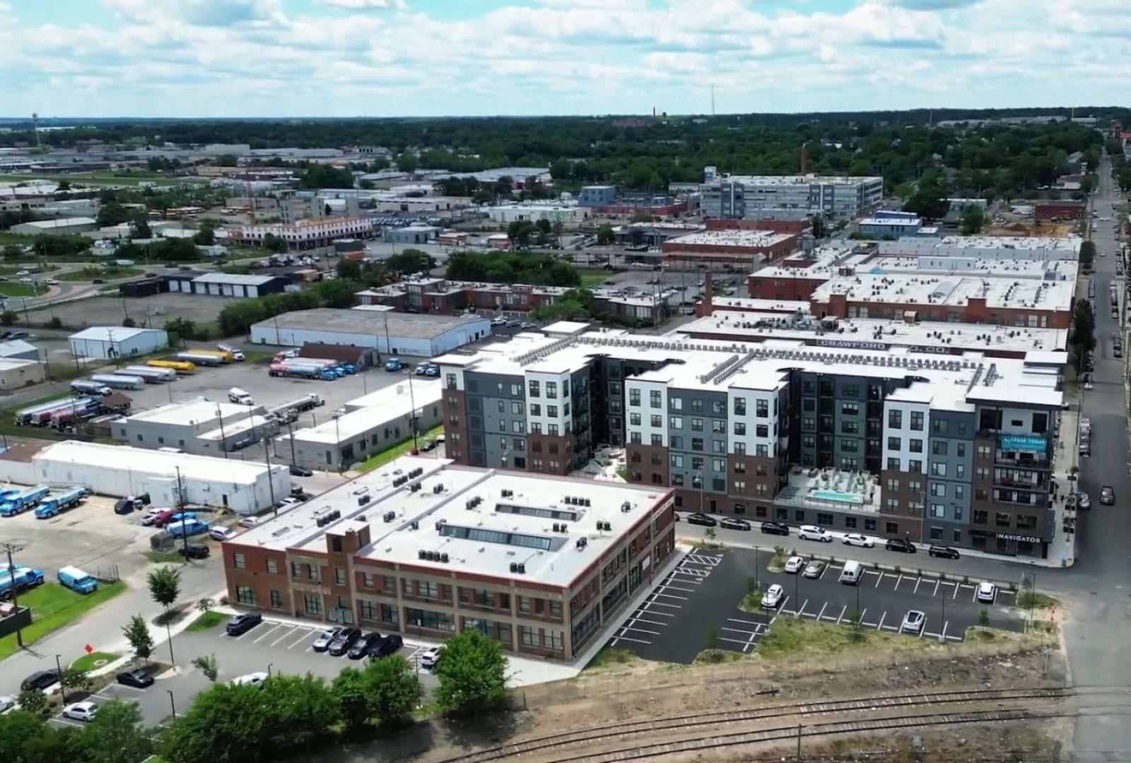 many buildings surrounded by trees